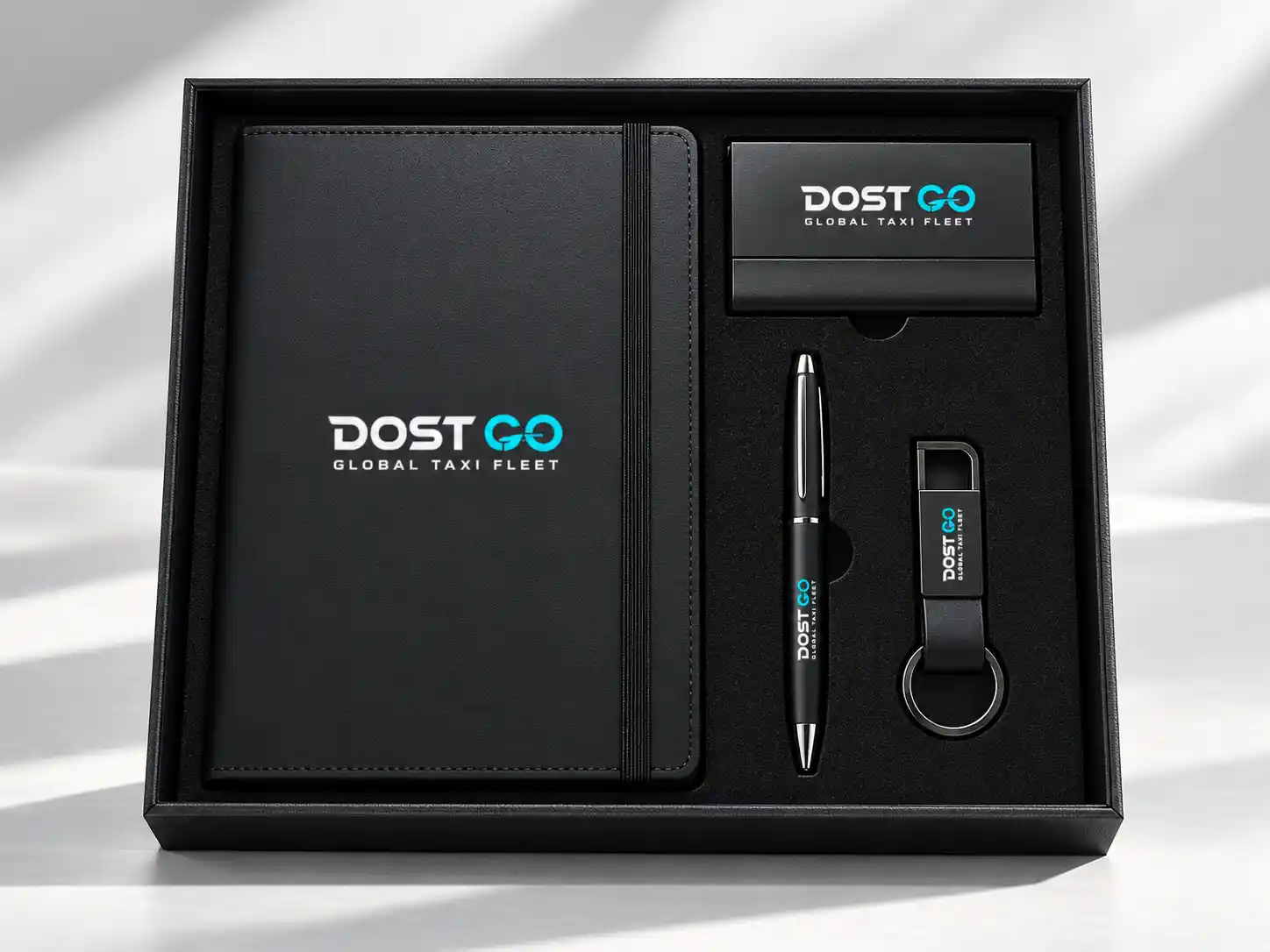 Black corporate gift set with branded notebook, pen and bottle
