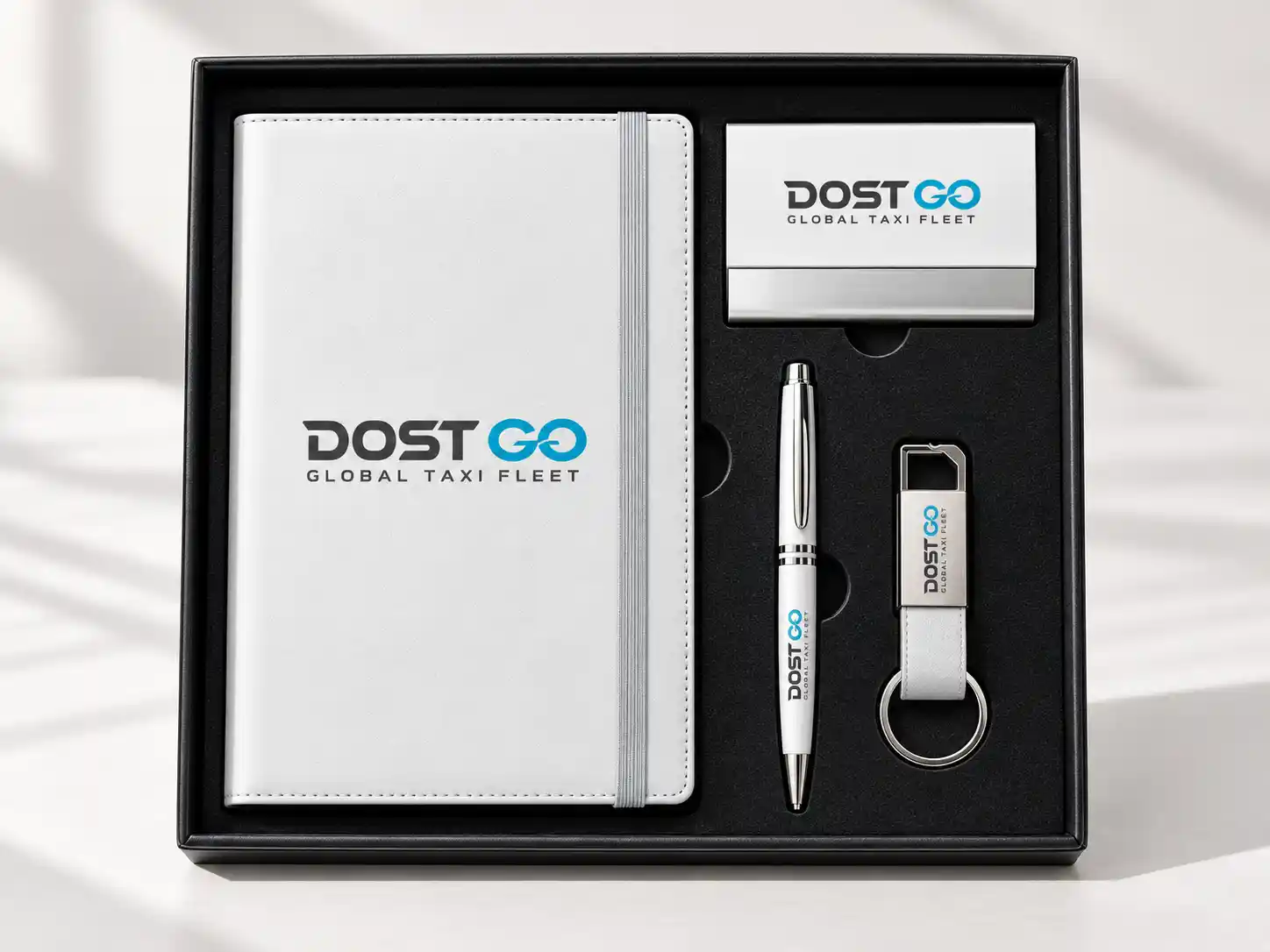 White corporate gift set with branded notebook, pen and bottle