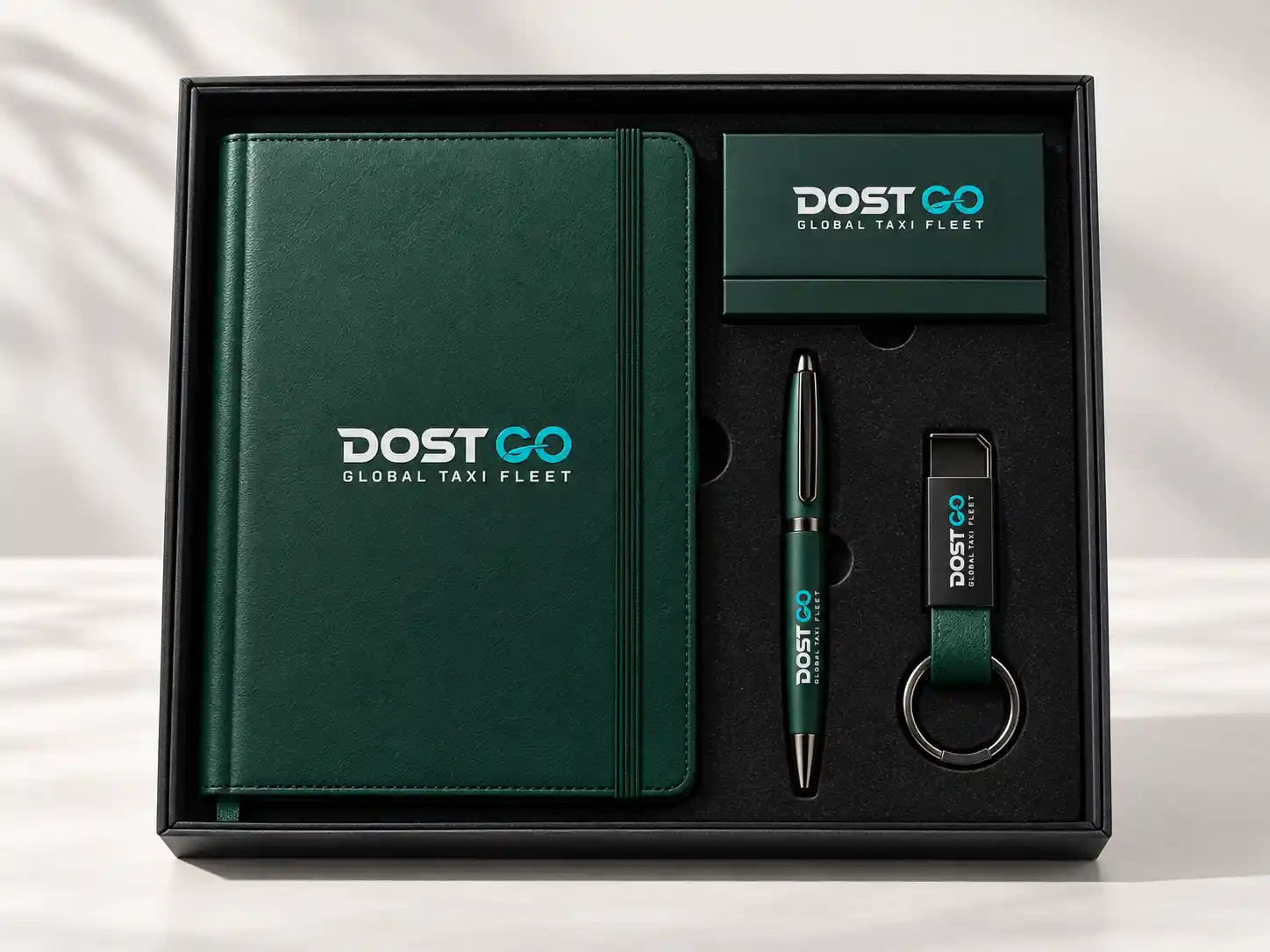Green corporate gift set with branded notebook, pen and bottle